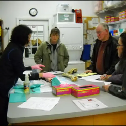 Veterinarian teaching clients with diagrams